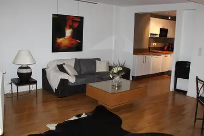 Coin salon dans l'établissement Les Appartements de Home Petite Venise