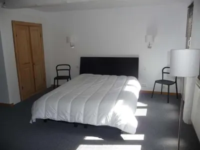 Un ou plusieurs lits dans un hébergement de l'établissement Les Appartements de Home Petite Venise