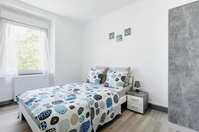 Un ou plusieurs lits dans un hébergement de l'établissement Comfort Stay Basel Airport 2A46