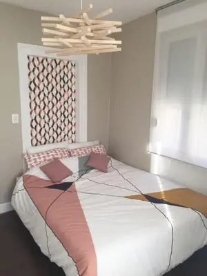 Un ou plusieurs lits dans un hébergement de l'établissement Gîte Hopla 2 chambres