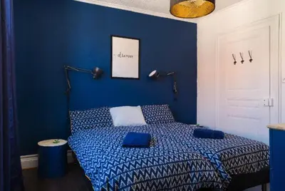 Un ou plusieurs lits dans un hébergement de l'établissement Gîte Hopla 2 chambres