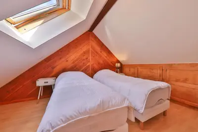 Un ou plusieurs lits dans un hébergement de l'établissement Le Chalet du Tanet spa sauna terrasse en Alsace