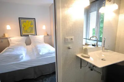 Un ou plusieurs lits dans un hébergement de l'établissement Le Duplex de Jules