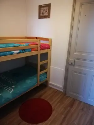 Un ou plusieurs lits dans un hébergement de l'établissement Le Cosy