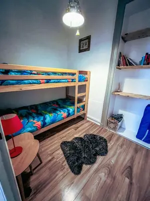Un ou plusieurs lits dans un hébergement de l'établissement Le Cosy