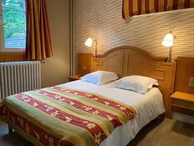 Un ou plusieurs lits dans un hébergement de l'établissement Hotel Au Cerf