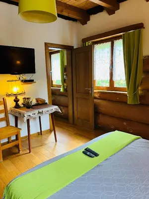 Un ou plusieurs lits dans un hébergement de l'établissement Chambres d'hôtes Les Rondins De La Fecht