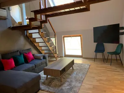 Coin salon dans l'établissement Appart LE COUCOU