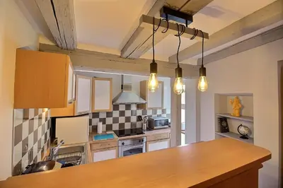 Cuisine ou kitchenette dans l'établissement LE PTIT BARTHO