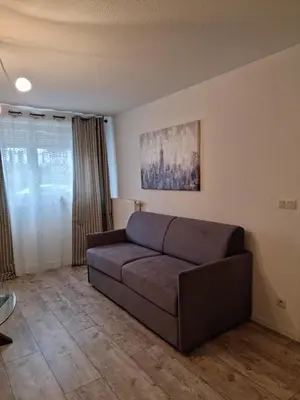Coin salon dans l'établissement Résidence Villa d'Ambre
