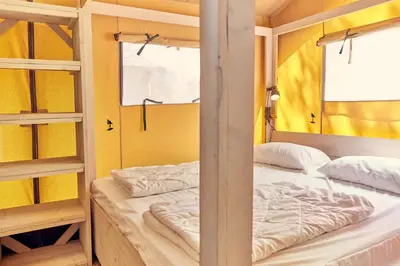 Un ou plusieurs lits dans un hébergement de l'établissement Glamping the Vosges