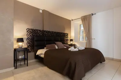 Un ou plusieurs lits dans un hébergement de l'établissement Travel Homes - The Ancienne Poste, Petite Venise