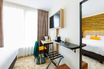 Télévision ou salle de divertissement dans l'établissement Best Western Mulhouse Salvator Centre