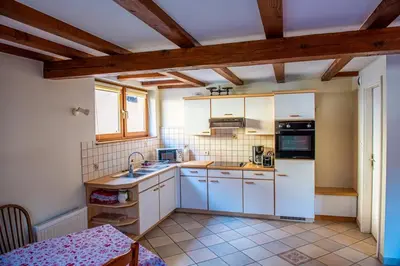 Cuisine ou kitchenette dans l'établissement Chez René