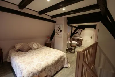 Un ou plusieurs lits dans un hébergement de l'établissement Appartement Louise avec Balcon