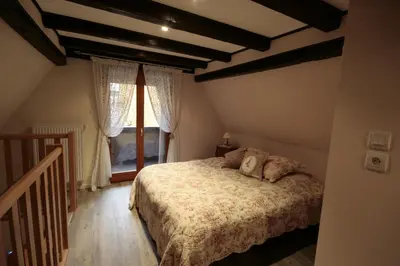 Un ou plusieurs lits dans un hébergement de l'établissement Appartement Louise avec Balcon