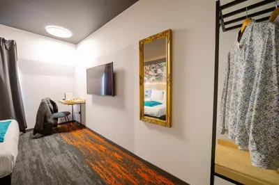 Télévision ou salle de divertissement dans l'établissement Berti Hotel - Mulhouse Centre Gare