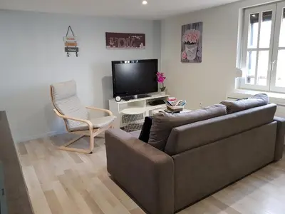 Télévision ou salle de divertissement dans l'établissement Le Cocon de Tom
