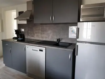 Cuisine ou kitchenette dans l'établissement Le Cocon de Tom