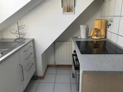 Cuisine ou kitchenette dans l'établissement Résidence de l’ex hôtel des roches