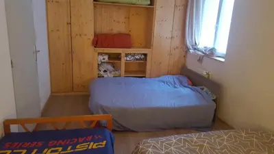 Un ou plusieurs lits dans un hébergement de l'établissement maison bleue