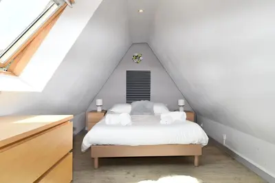 Un ou plusieurs lits dans un hébergement de l'établissement Appartement Villa Joseph