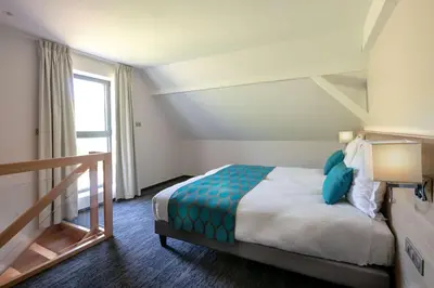Un ou plusieurs lits dans un hébergement de l'établissement Best Western Plus Hotel & SPA Le Schoenenbourg
