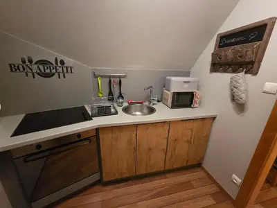 Cuisine ou kitchenette dans l'établissement Gîte de la Tour