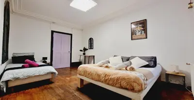 Un ou plusieurs lits dans un hébergement de l'établissement Gitedaval Maison de maître & spa