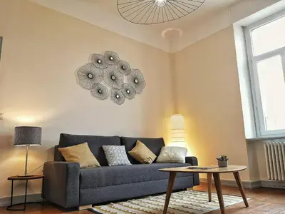 Coin salon dans l'établissement Le XI - Suite Colmar Gare