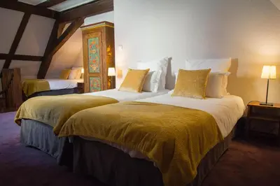 Un ou plusieurs lits dans un hébergement de l'établissement Hôtel De La Couronne