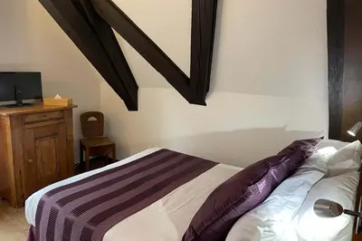 Un ou plusieurs lits dans un hébergement de l'établissement Hôtel De La Couronne