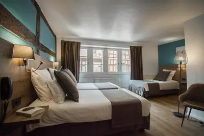 Un ou plusieurs lits dans un hébergement de l'établissement Hôtel De La Couronne
