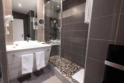 Salle de bains dans l'établissement Grand Hôtel Du Tonneau D'Or