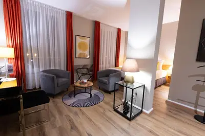 Coin salon dans l'établissement Grand Hôtel Du Tonneau D'Or