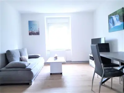 Coin salon dans l'établissement Comfort Stay Basel Airport 1A46