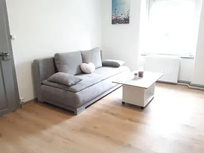 Coin salon dans l'établissement Comfort Stay Basel Airport 1A46