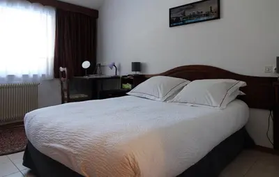Un ou plusieurs lits dans un hébergement de l'établissement Hotel-Spa & Restaurant Logis Domaine Langmatt