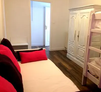 Un ou plusieurs lits dans un hébergement de l'établissement Hôtel De La Paix