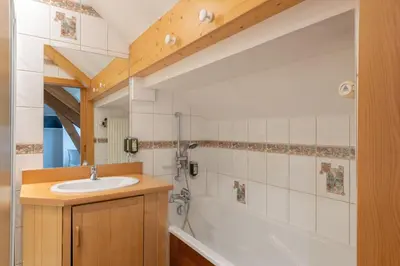 Salle de bains dans l'établissement Hôtel De La Paix