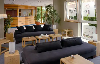 Coin salon dans l'établissement Als Hôtel