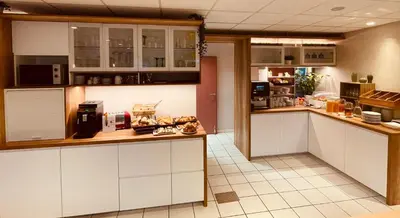 Cuisine ou kitchenette dans l'établissement Als Hôtel