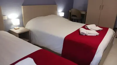 Un ou plusieurs lits dans un hébergement de l'établissement Hôtel du Ô des Bluches