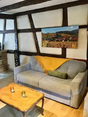 Coin salon dans l'établissement Huna’gîte