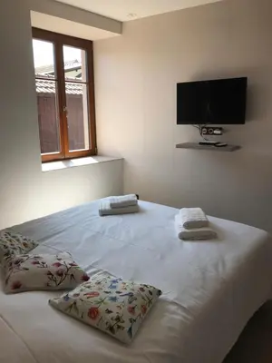 Un ou plusieurs lits dans un hébergement de l'établissement La bacchante