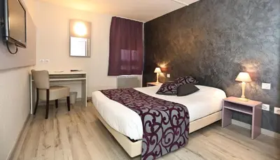 Un ou plusieurs lits dans un hébergement de l'établissement Hôtel restaurant Relais de Rixheim Ile Napoléon Mulhouse