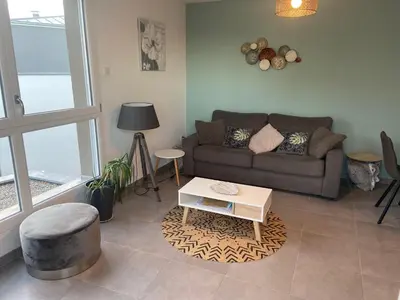 Coin salon dans l'établissement Appartement Magnîolia proche centre Ville