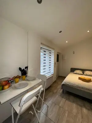 Un ou plusieurs lits dans un hébergement de l'établissement Le 6 - Joli petit studio, Centre ville - stationnement gratuit