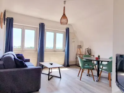 Coin salon dans l'établissement GRENIER DES CIGOGNES