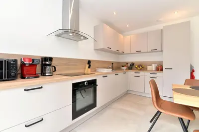Cuisine ou kitchenette dans l'établissement Gîte de Munt'Z SPA, Sauna, piscine, proche de Colmar